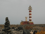 27847 Pillar of rocks and lighthouse Faro de Toston.jpg